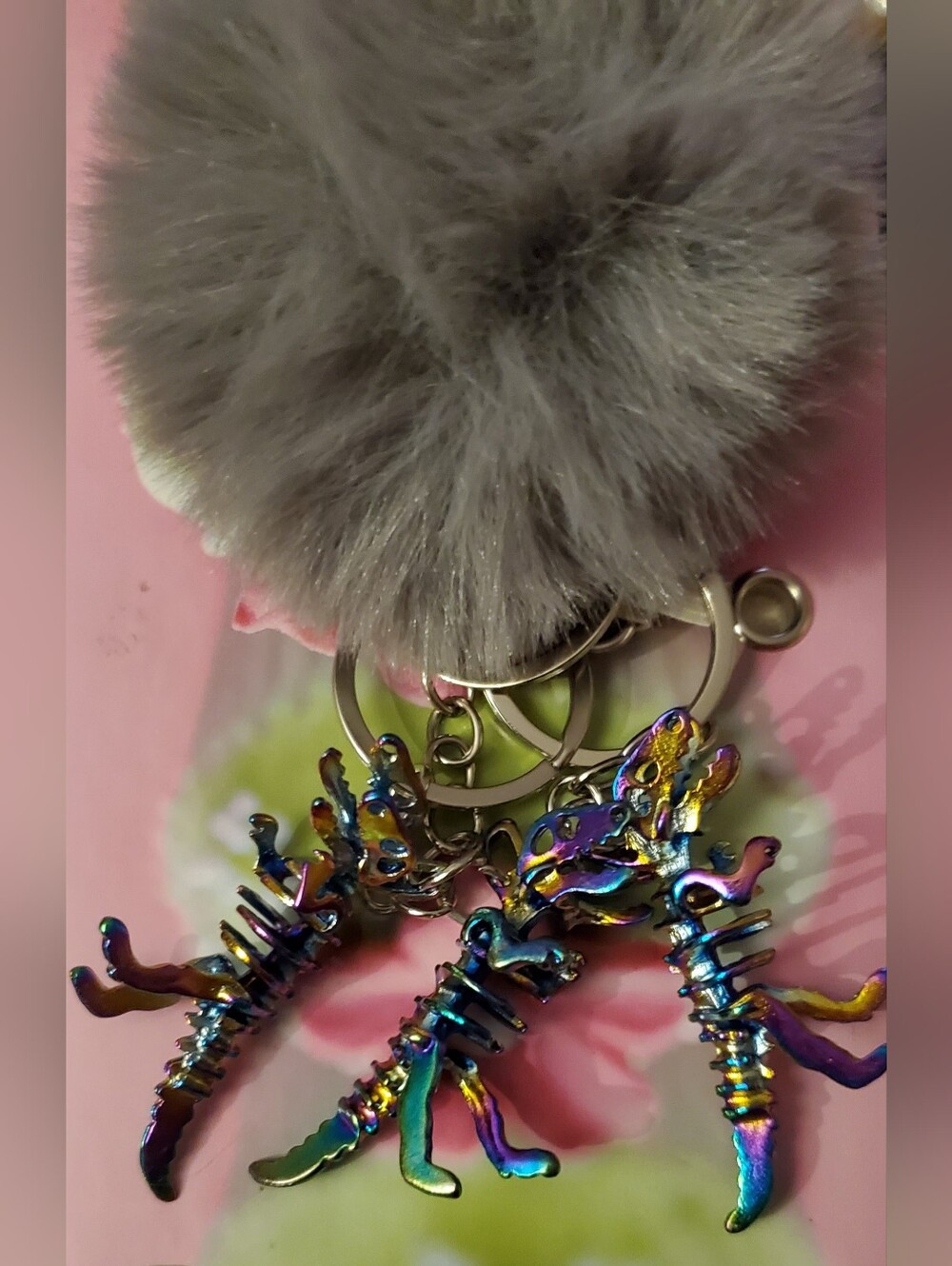 Iridescent Dinosaur Skeleton Keychain And Pom Pom